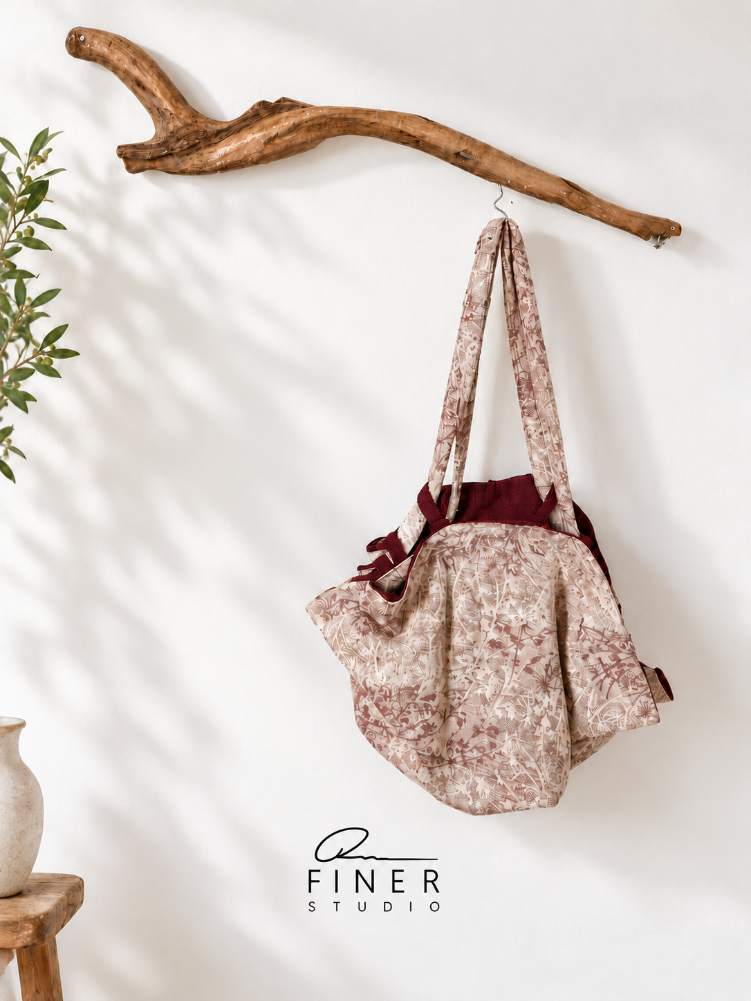 Fine R Studio ivory floral fabric shoulder bag with burgundy lining and long matching straps.