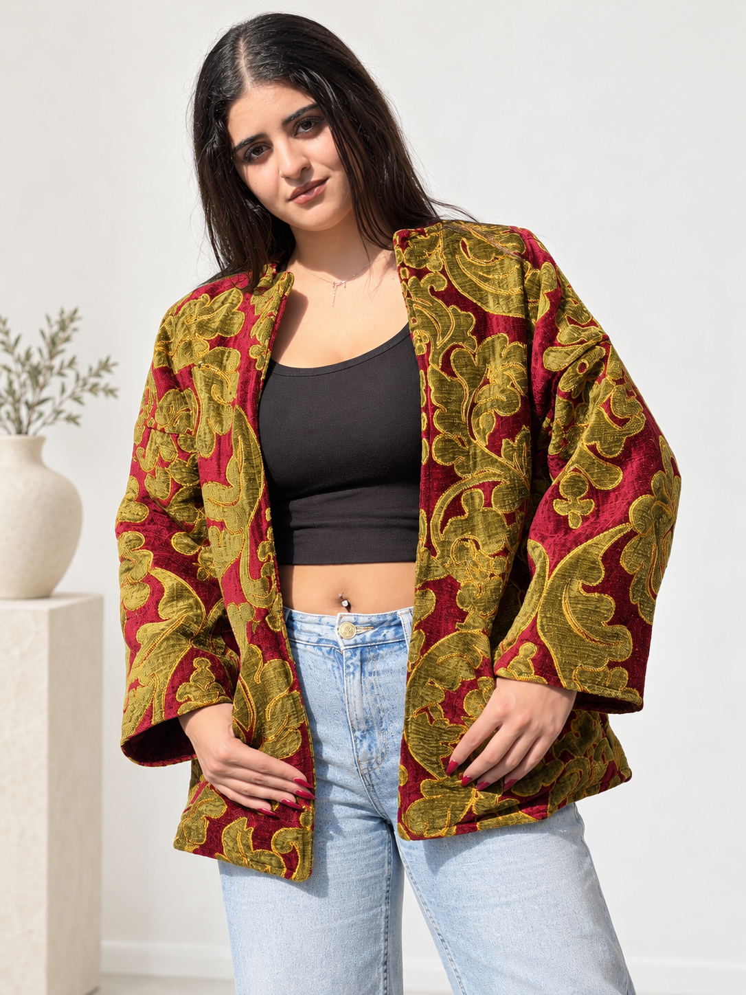 Front view of Fine R Studio burgundy and olive floral velvet jacket with an open front and wide sleeves.