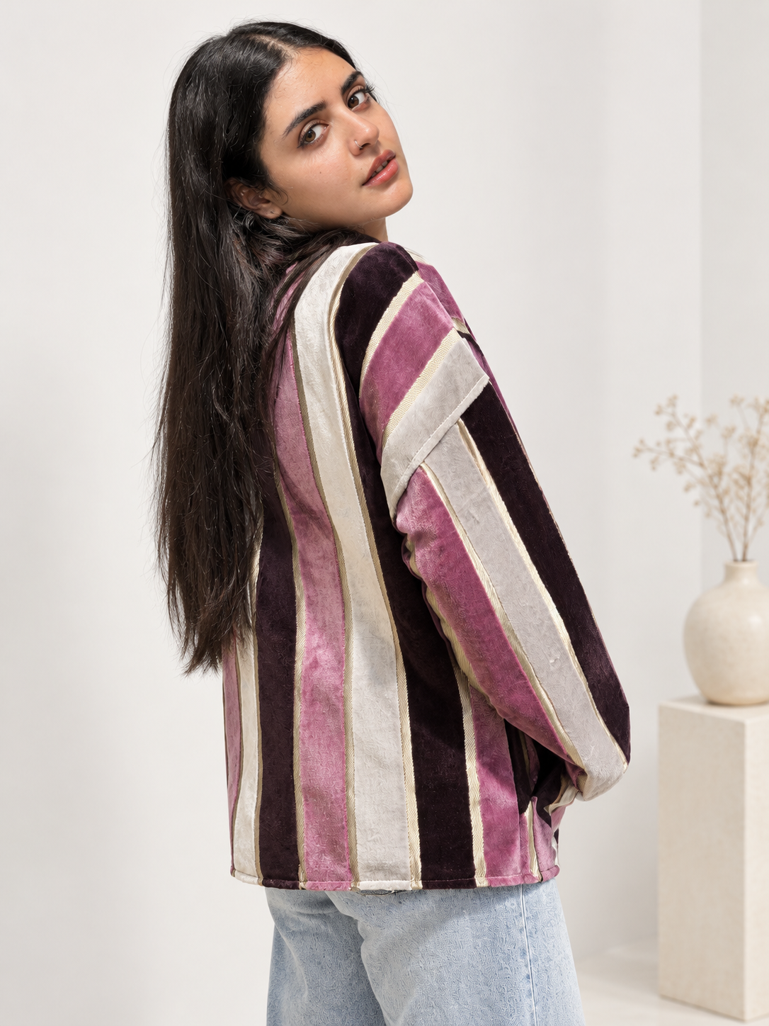 Back view of Fine R Studio striped velvet jacket in mauve, deep plum and ivory with narrow gold-toned lines.