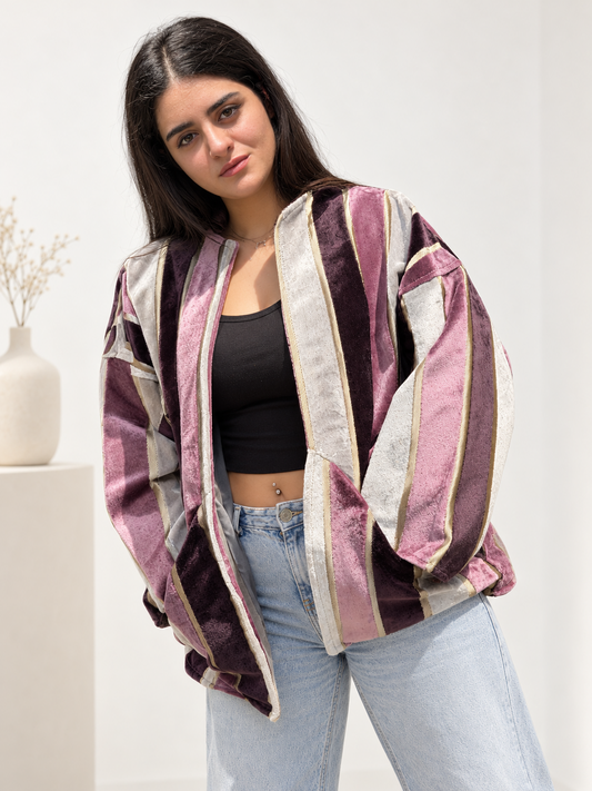 Front view of Fine R Studio velvet jacket with mauve, plum and ivory stripes, an open front and relaxed sleeves.