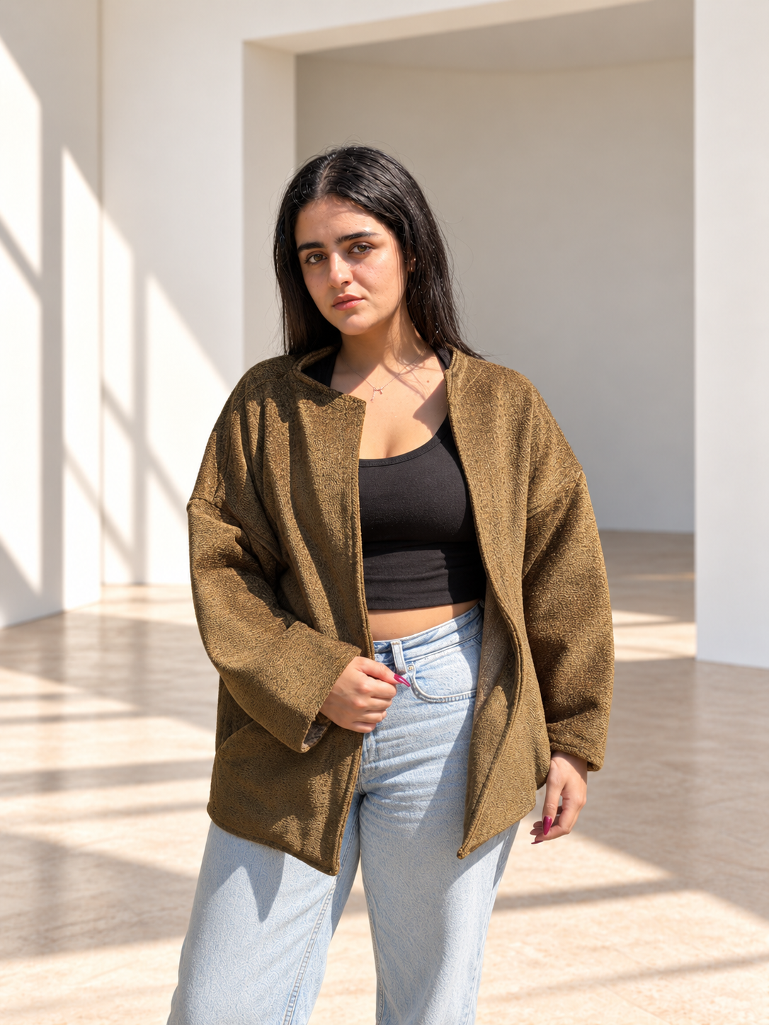 Front view of Fine R Studio olive textured jacket with an open front and relaxed sleeves.