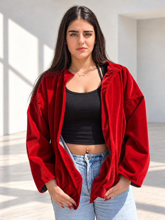 Front view of Fine R Studio red velvet art jacket with an open front and relaxed sleeves.